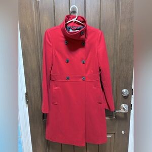 Red wool 3/4 length coat. Funnel neck, kick pleat. Worn 3 times